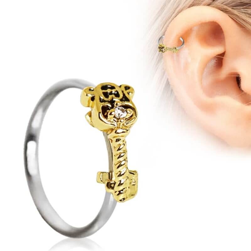 Helixpiercing med guldnyckel
